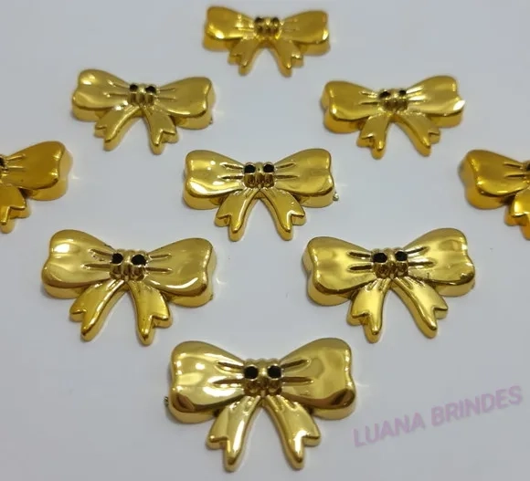 Aplique Laço de ABS Dourado com furo - pct c/12 unid